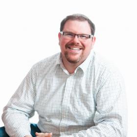 John Picozzi smiling against a white background