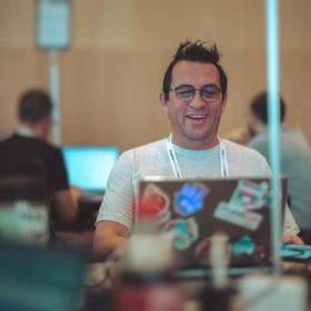 Carlos Ospina working on his laptop